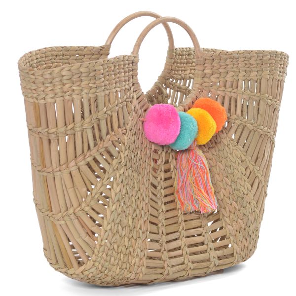 Basket bag made of straw with pompons 